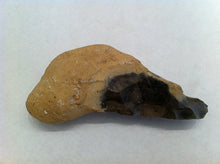 French hand axe, with cortex handle, and black stone